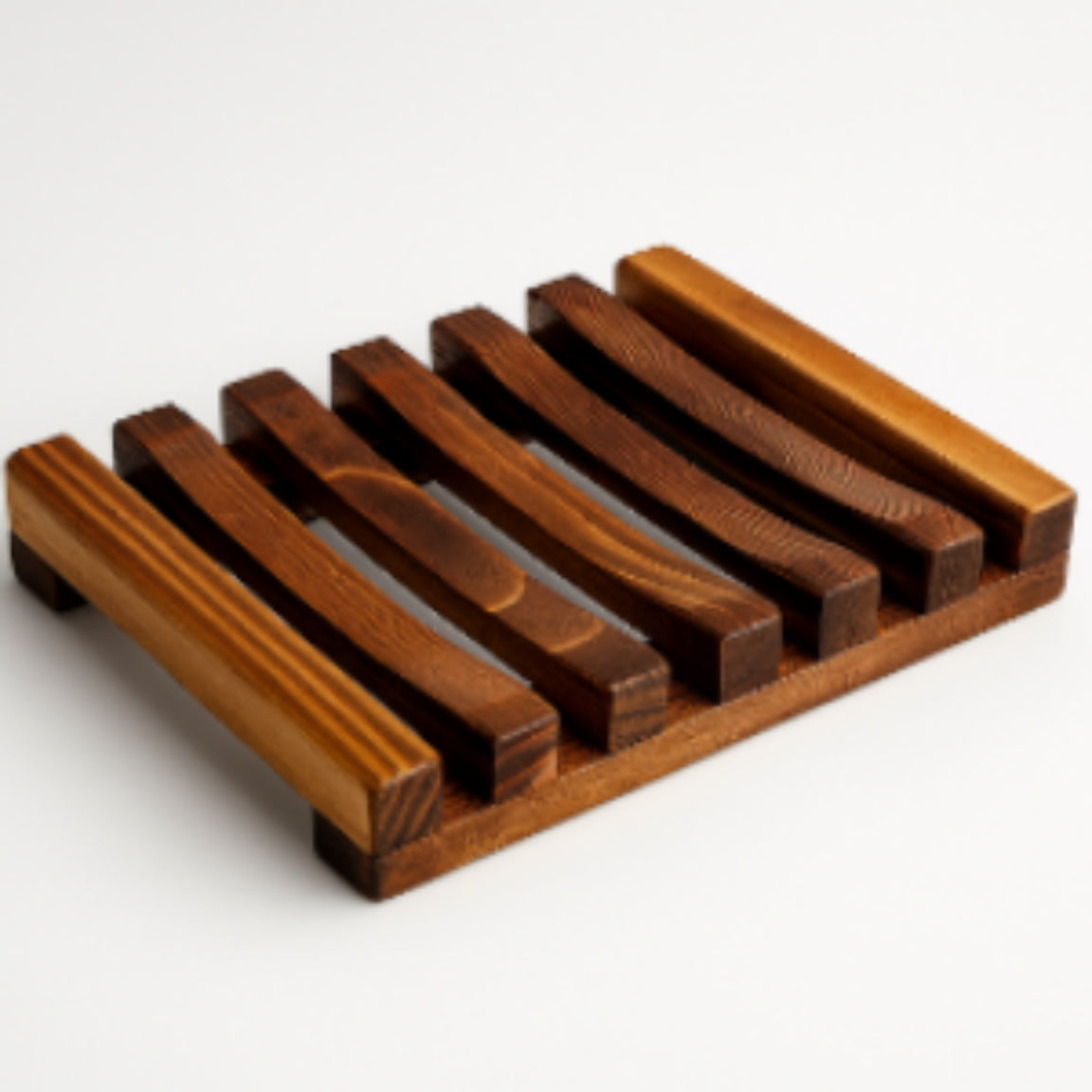 Wooden soap dish with a slatted design on a white background